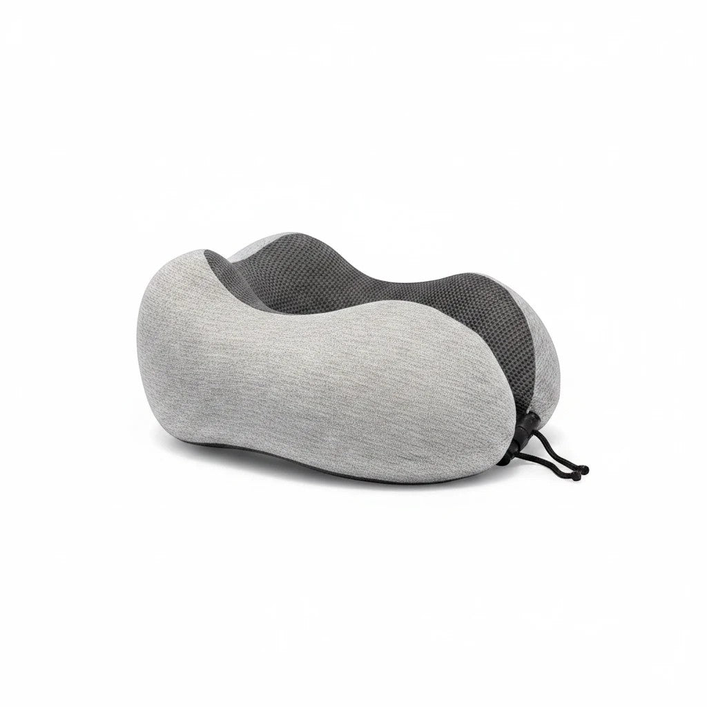 Sea Dragon Dreams ergonomic grey memory foam travel pillow with a contoured shape for neck support and adjustable cord.