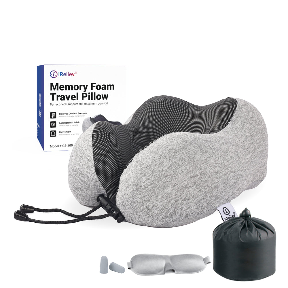 Sea Dragon Dreams memory foam travel pillow with ergonomic neck support, grey fabric, carrying bag, and sleep accessories.