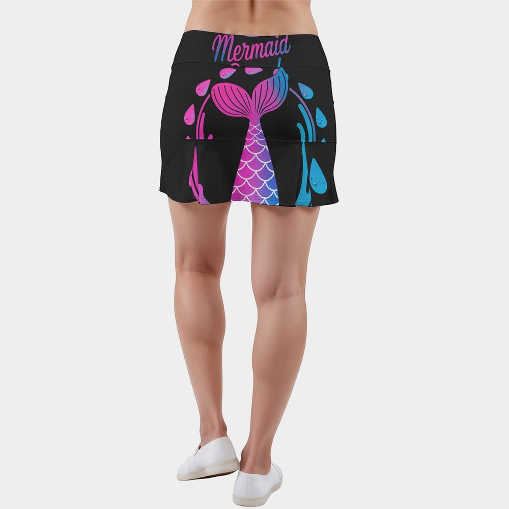Sea Dragon Dreams active skort with inner shorts, featuring a black fabric with a pink and blue mermaid tail design.