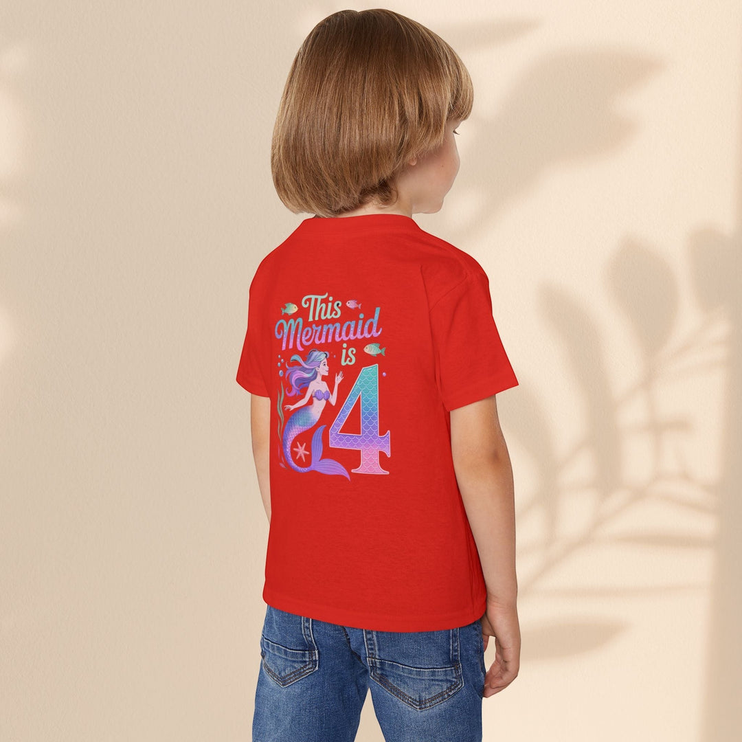 Child wearing a red Sea Dragon Dreams cotton t-shirt with a This Mermaid Is 4 birthday graphic on the back.