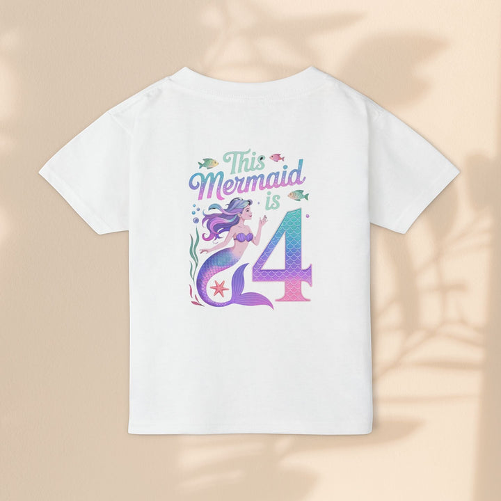 Sea Dragon Dreams white cotton toddler t-shirt with This Mermaid Is 4 birthday graphic and colorful mermaid design.