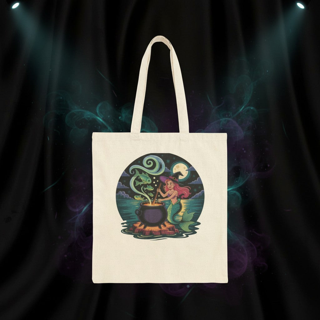 Sea Dragon Dreams natural cotton canvas tote bag featuring a whimsical mermaid witch stirring a magical cauldron.