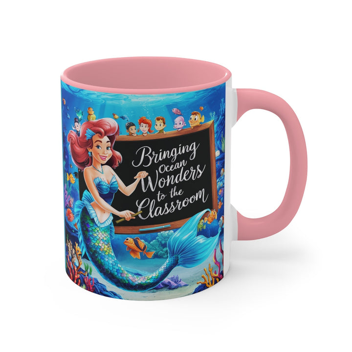 Sea Dragon Dreams ceramic accent mug featuring a mermaid teacher and ocean life with pink handle and interior