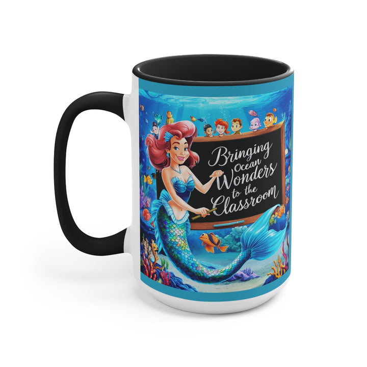 Sea Dragon Dreams ceramic mug featuring a mermaid teacher with ocean classroom graphics and a black handle and rim.