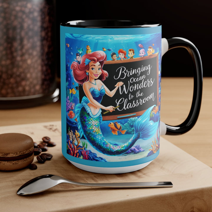 Sea Dragon Dreams ceramic mug featuring a mermaid teacher in an underwater classroom with ocean life and text.