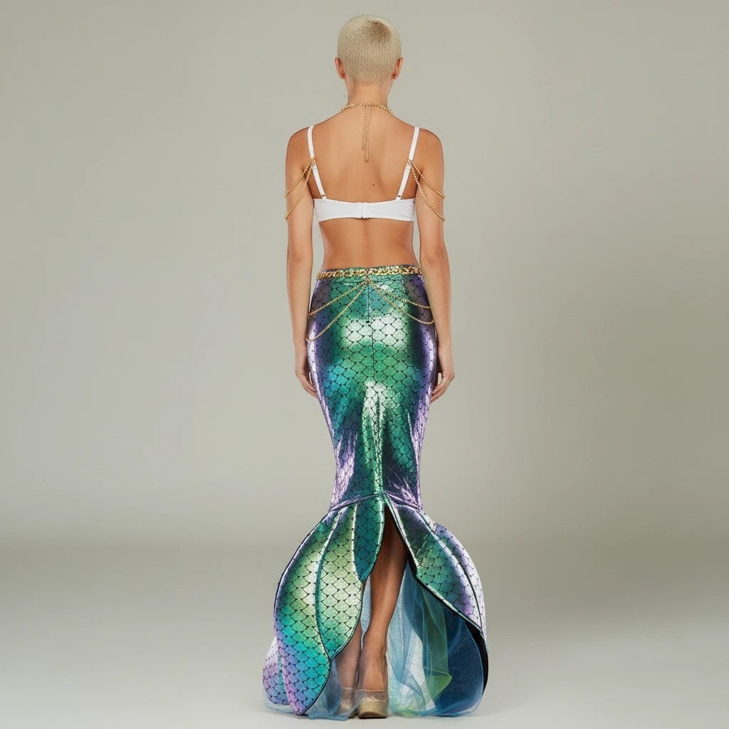 Sea Dragon Dreams mermaid costume featuring a white shell top with gold chains and an iridescent green mermaid tail.