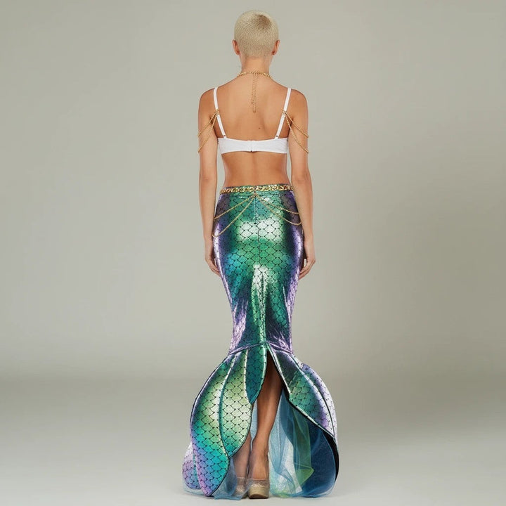 Sea Dragon Dreams mermaid costume featuring a white shell top with gold chains and an iridescent green mermaid tail.