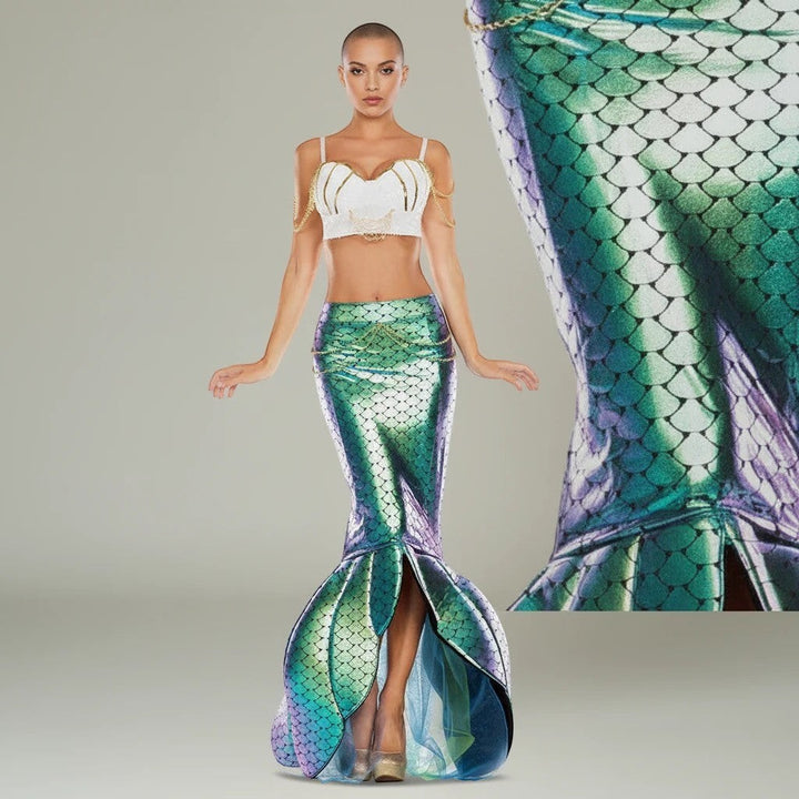 Sea Dragon Dreams mermaid costume featuring a white sequin shell bra and an iridescent green scale mermaid tail skirt.