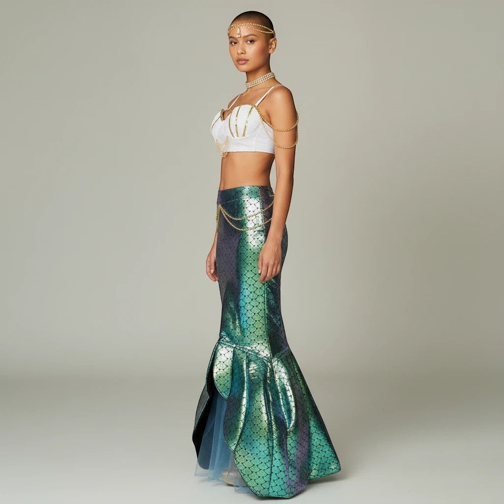 Sea Dragon Dreams mermaid costume with white sequin shell top, gold chains, and iridescent green tail skirt on model