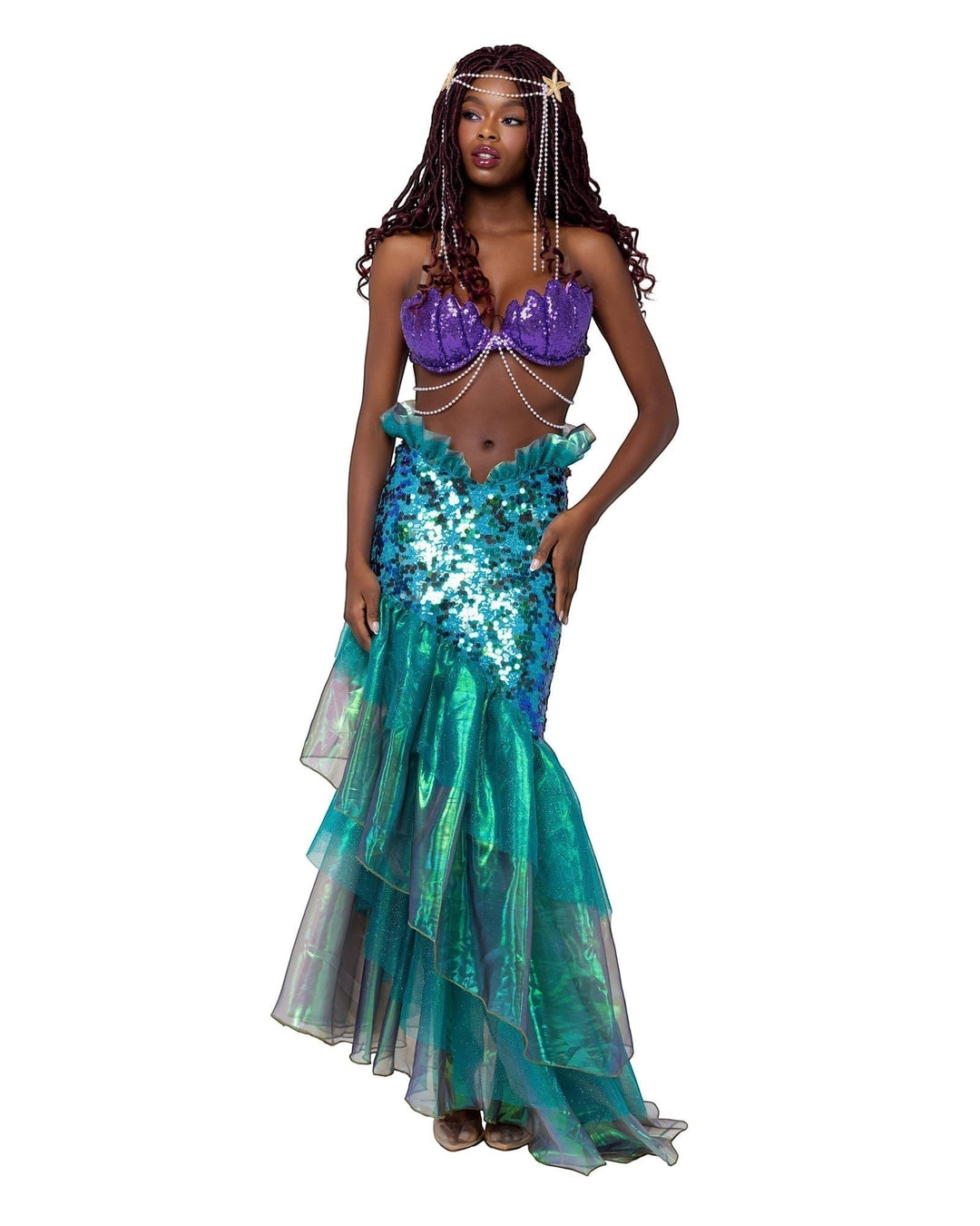 Model wearing Sea Dragon Dreams two-piece mermaid costume with purple sequin shell bra and green blue scale skirt.