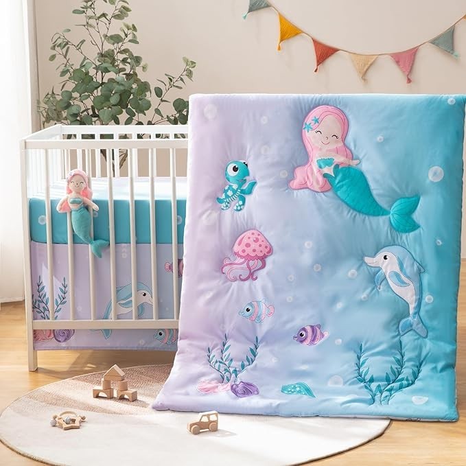 Sea Dragon Dreams 4-piece mermaid crib bedding set featuring a cartoon quilt, fitted sheet, skirt, and plush toy.
