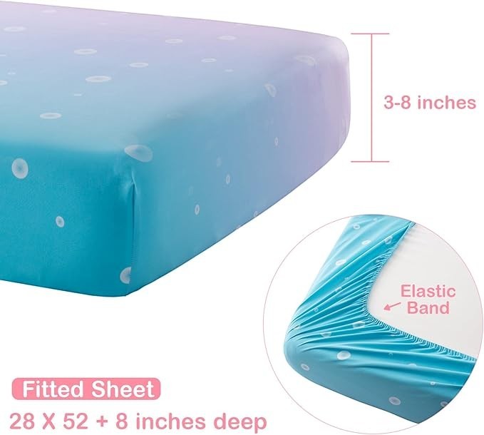 Sea Dragon Dreams mermaid crib fitted sheet with blue and purple ombre pattern and elastic band for a secure fit