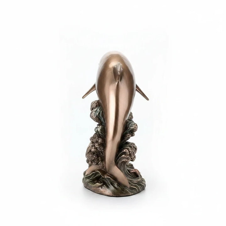 Sea Dragon Dreams polystone mermaid and dolphin figurine on a cresting wave, viewed from the back.