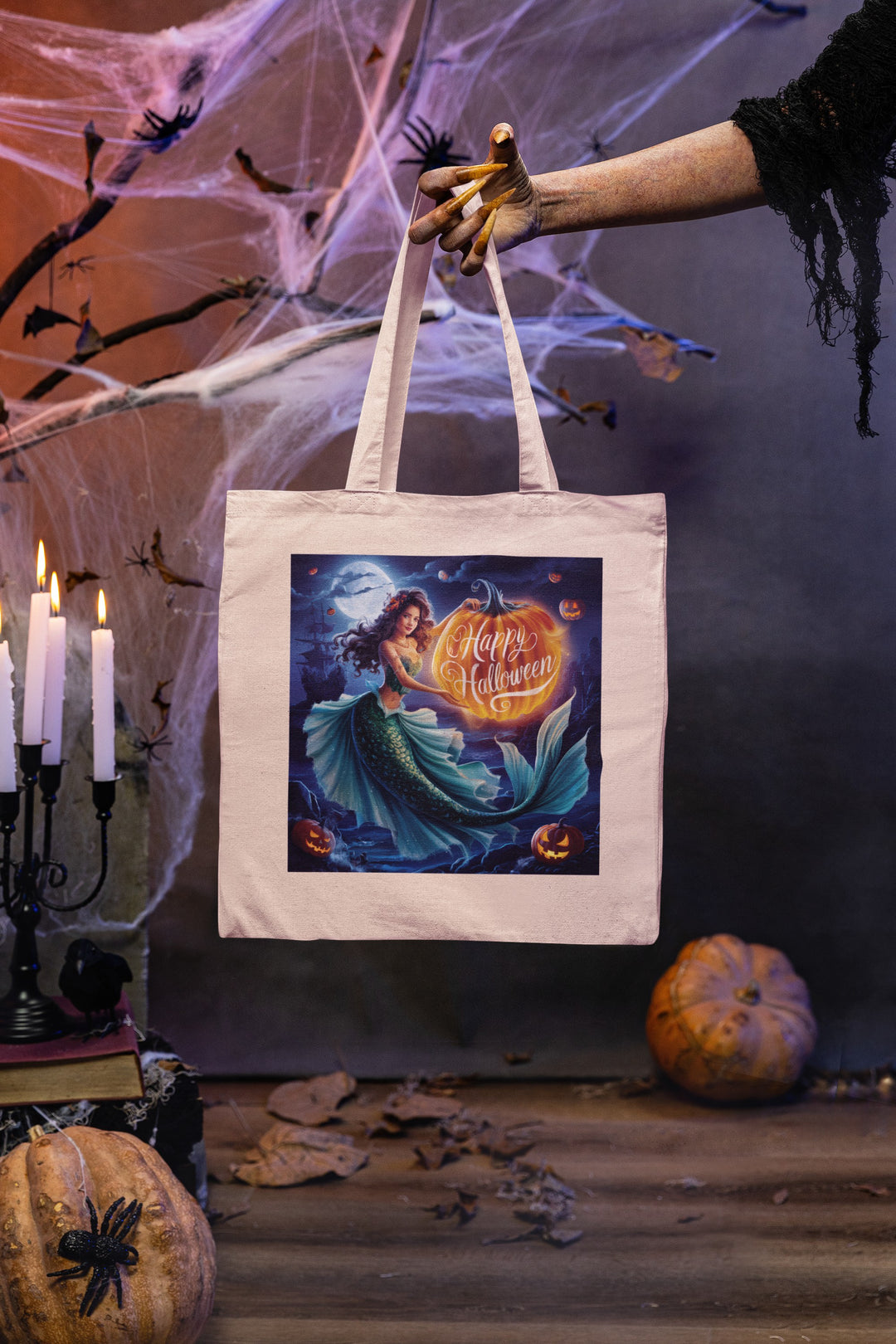 Sea Dragon Dreams natural cotton canvas tote bag featuring a mermaid and pumpkin Halloween graphic in a spooky setting.