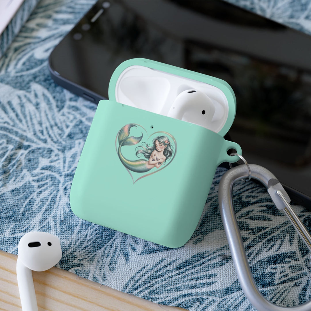 Sea Dragon Dreams mint green TPU AirPods case featuring a mermaid heart illustration and a silver metal carabiner.