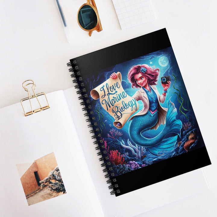 Sea Dragon Dreams spiral notebook featuring a mermaid marine biologist illustration on a dark ocean background