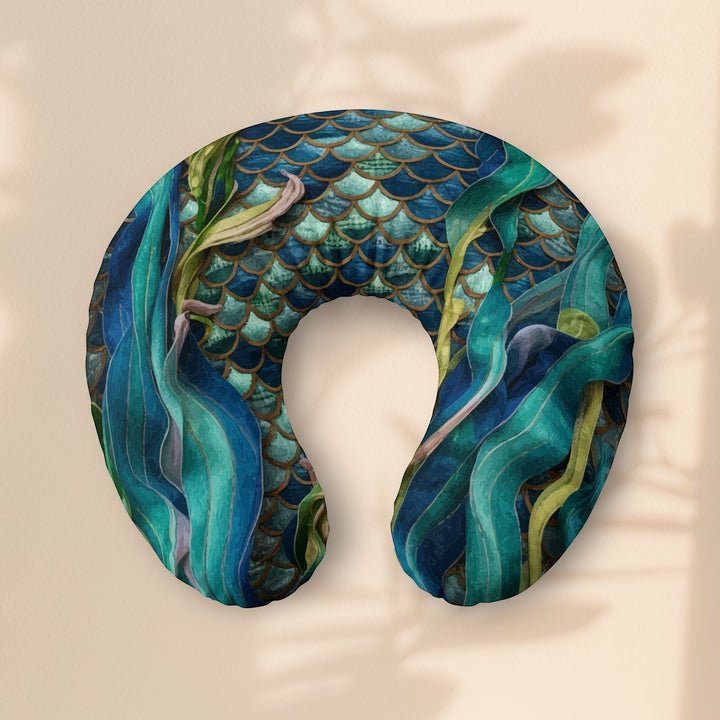 Sea Dragon Dreams nursing pillow cover featuring a teal mermaid scale pattern and flowing aquatic seaweed design.