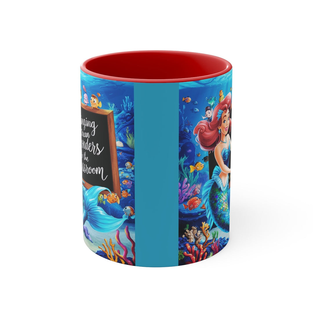 Sea Dragon Dreams ceramic mug with red interior featuring a vibrant mermaid and ocean classroom illustration.