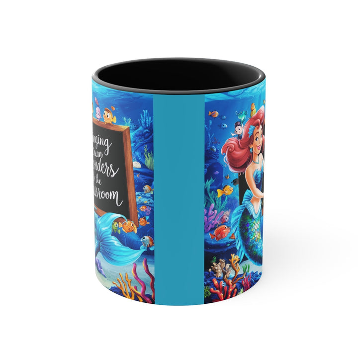 Sea Dragon Dreams ceramic accent mug featuring a vibrant mermaid and ocean classroom design with a black interior.