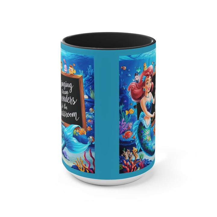 Sea Dragon Dreams ceramic mug featuring a mermaid and ocean classroom scene with a vibrant blue interior and handle