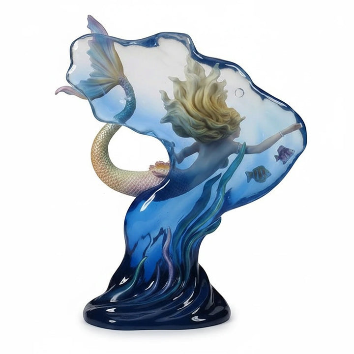 Sea Dragon Dreams polystone mermaid figurine with blond hair, gold-tinged tail, and translucent blue water backdrop.