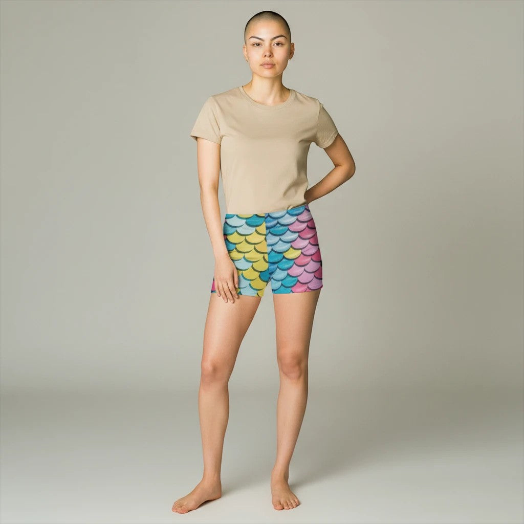 Sea Dragon Dreams women's skinny fit shorts featuring a vibrant multi-colored mermaid scale pattern