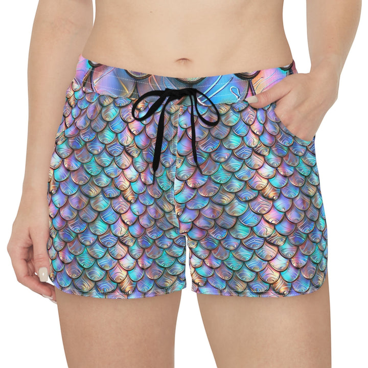 Sea Dragon Dreams women's casual shorts featuring an iridescent rainbow mermaid scale print and black drawstring.