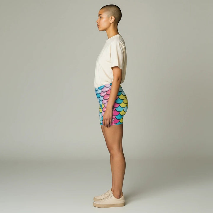 Sea Dragon Dreams women's skinny fit shorts featuring a vibrant multi-colored mermaid scale pattern