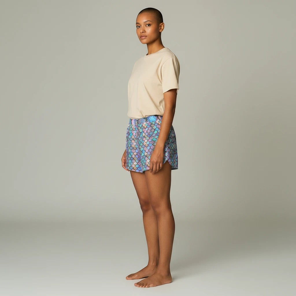 Sea Dragon Dreams women's casual shorts with iridescent rainbow mermaid scale print, elastic waist, and side pockets.