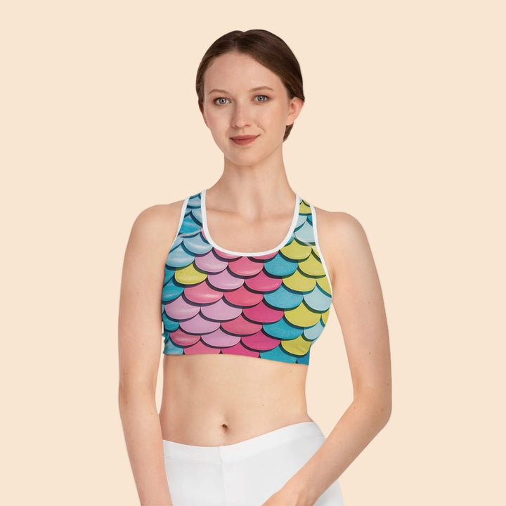 Sea Dragon Dreams MNMS seamless sports bra featuring a vibrant multi-colored mermaid scale print and racerback cut.