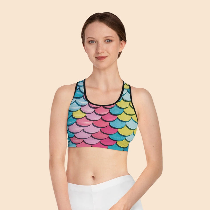 Sea Dragon Dreams MNMS seamless sports bra featuring a vibrant multi-colored mermaid scale print and racerback cut.