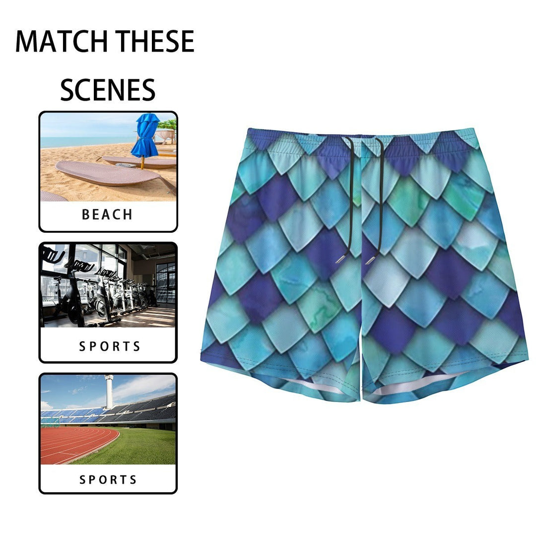 Sea Dragon Dreams men's swim shorts featuring a vibrant blue and teal mermaid scale pattern with an elastic waistband