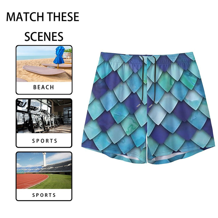 Sea Dragon Dreams men's swim shorts featuring a vibrant blue and teal mermaid scale pattern with an elastic waistband