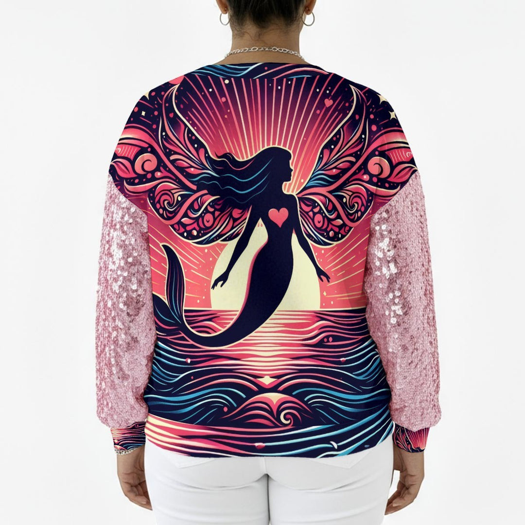 Sea Dragon Dreams sweatshirt with pink sequin sleeves and a back graphic of a mermaid silhouette at sunset.