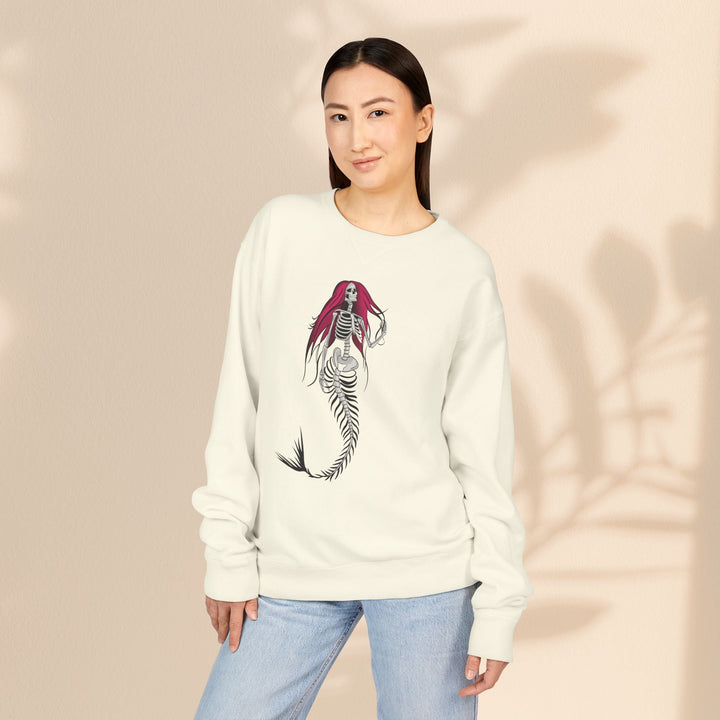 Sea Dragon Dreams crewneck sweatshirt in off-white featuring a gothic mermaid skeleton graphic with pink hair.