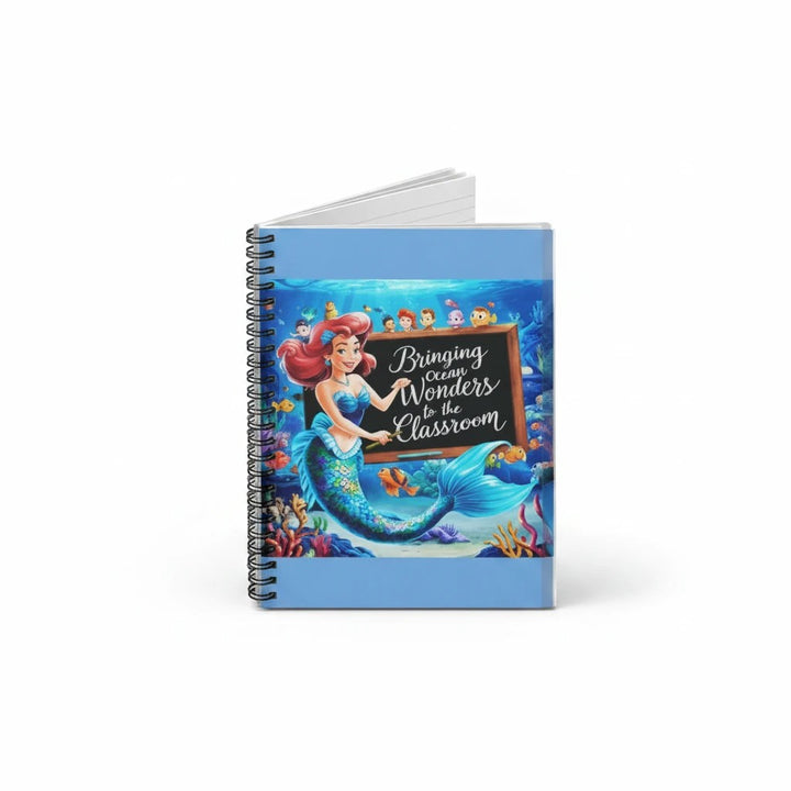 Sea Dragon Dreams spiral notebook featuring a whimsical mermaid teacher illustration on a blue classroom background.