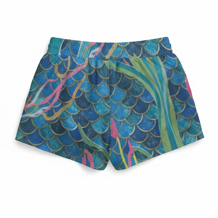 Sea Dragon Dreams women's sport skorts featuring a blue mermaid scale pattern with pink and green accents.