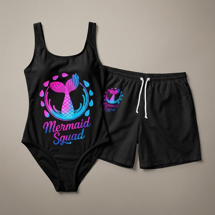 Sea Dragon Dreams black one-piece swimsuit and matching swim shorts with a pink and blue Mermaid Squad graphic print.