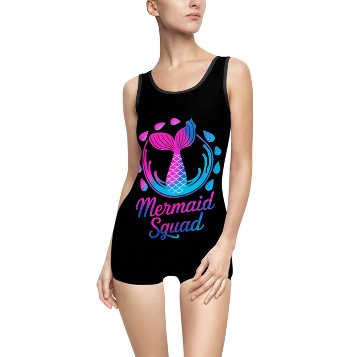 Sea Dragon Dreams vintage-style black one-piece swimsuit with a pink and blue Mermaid Squad graphic print