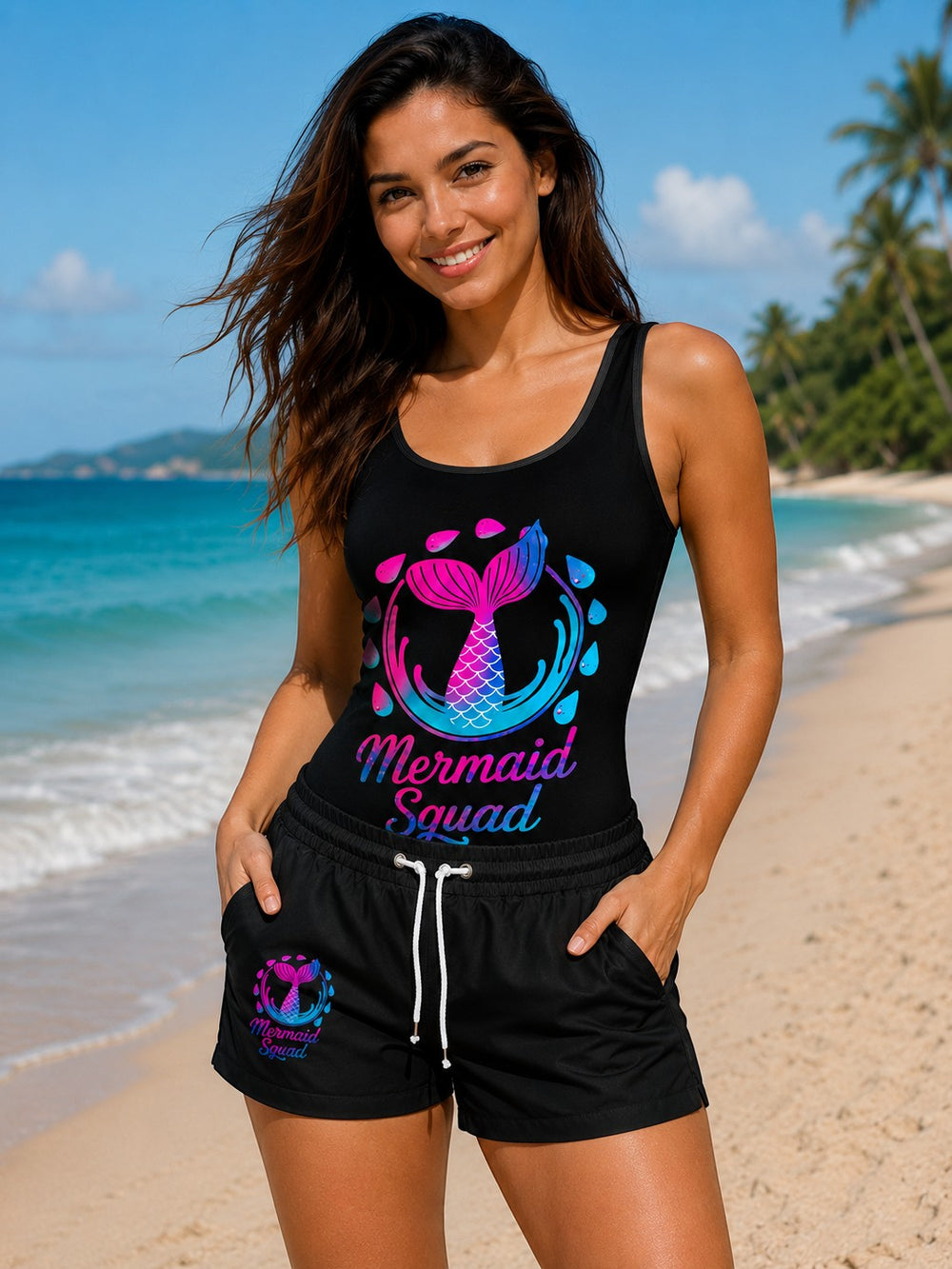 Sea Dragon Dreams vintage-style black one-piece swimsuit with Mermaid Squad graphic on a smiling woman at the beach
