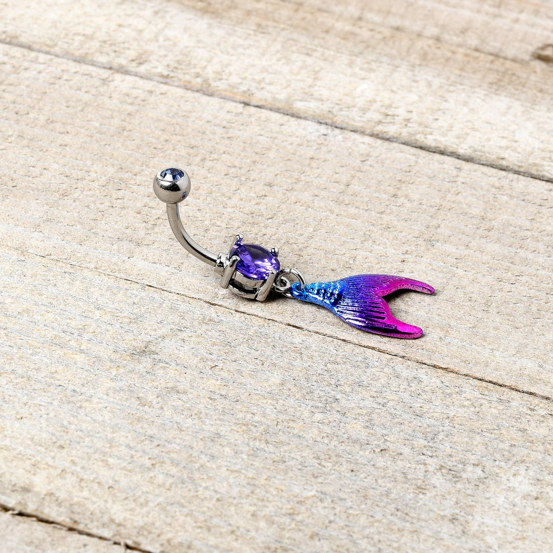 Sea Dragon Dreams purple gemstone belly ring with an aqua and pink enamel mermaid tail dangle charm.