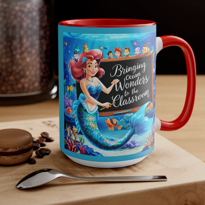 Sea Dragon Dreams ceramic mug with a mermaid teacher design, red handle, and ocean-themed classroom illustration.