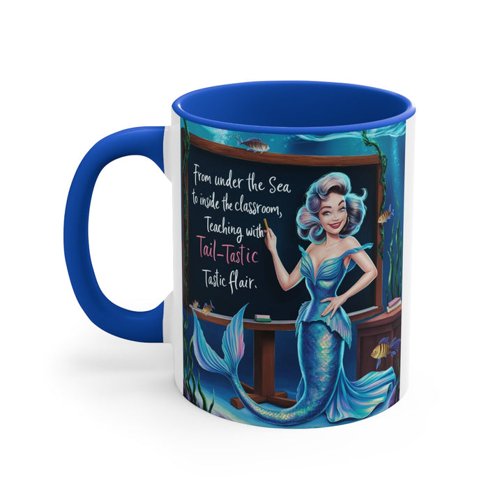 Sea Dragon Dreams 11oz ceramic accent mug with blue handle and interior, featuring a mermaid teacher illustration.