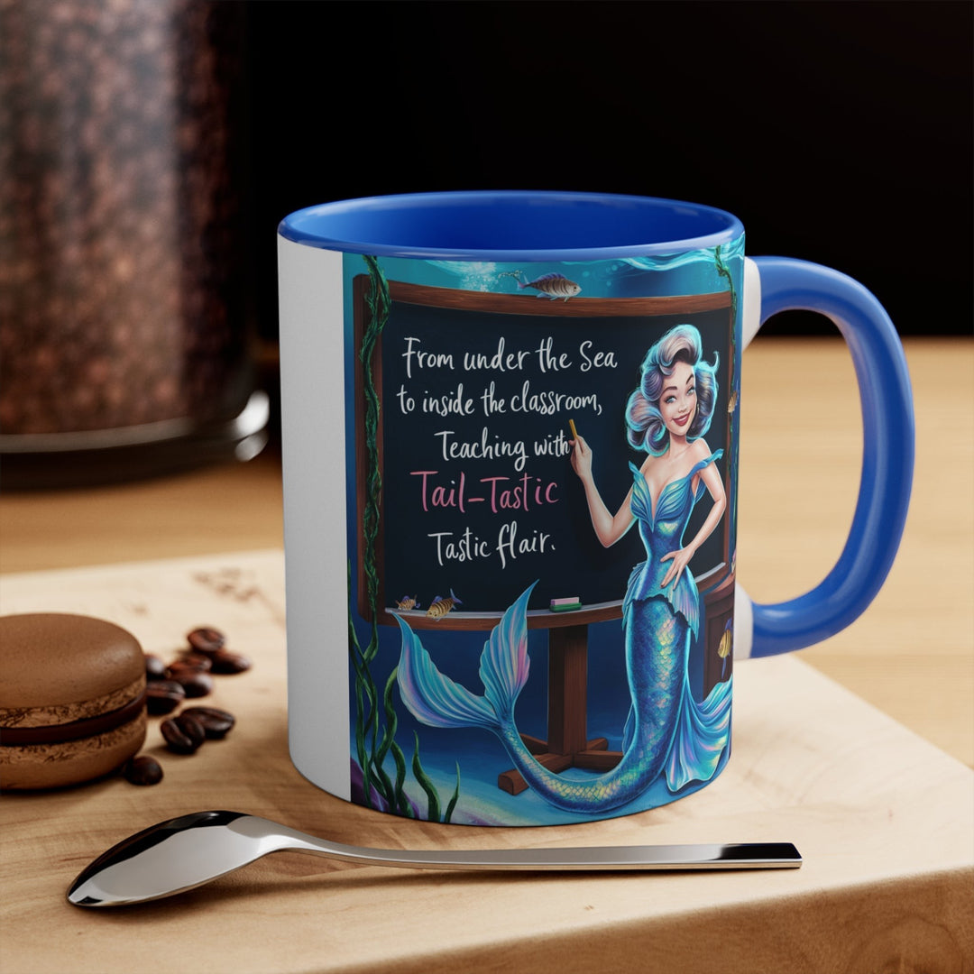 Sea Dragon Dreams 11oz ceramic accent mug with a blue handle and interior featuring a mermaid teacher illustration.