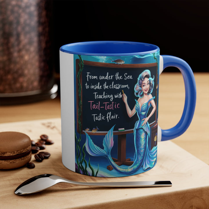 Sea Dragon Dreams 11oz ceramic accent mug with a blue handle and interior featuring a mermaid teacher illustration.