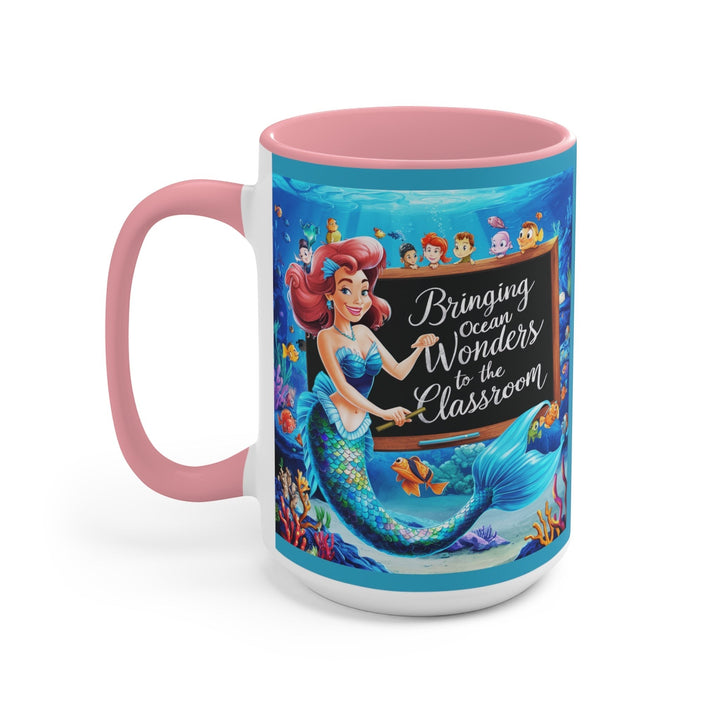 Sea Dragon Dreams ceramic mug with pink handle and interior featuring a mermaid teacher and ocean classroom design.