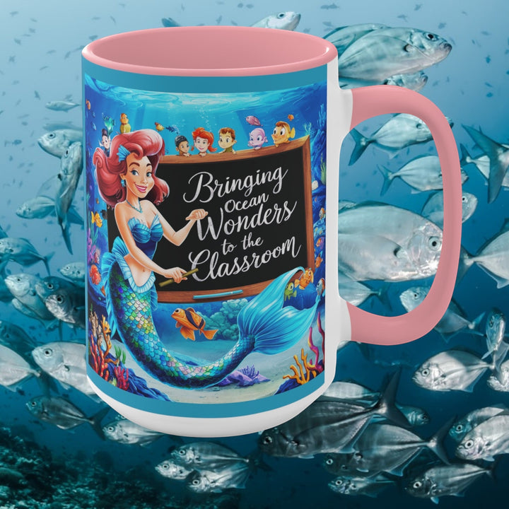 Sea Dragon Dreams ceramic mug with mermaid teacher illustration, pink handle, and ocean-themed classroom design.