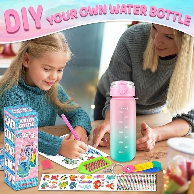 Sea Dragon Dreams mermaid DIY water bottle craft kit with stickers and paints being used by a young girl and woman