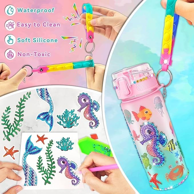 Sea Dragon Dreams mermaid water bottle craft kit with stickers, silicone strap, and gems for kids to decorate.