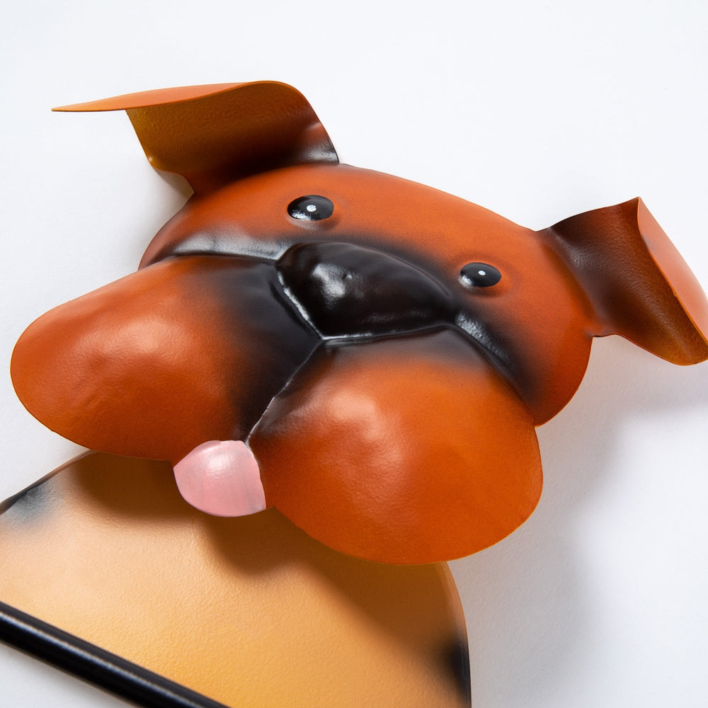 Sea Dragon Dreams metal dog toilet paper holder with a playful brown boxer-style face and pink tongue.